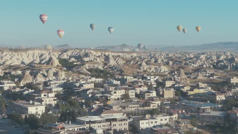 Goreme-Village-Cappadocia-Hot-air-balloons-in-sky-Establishing-Shot
