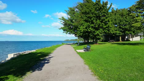 Beautiful-green-grass-park-and-blue-water-lake-in-Canada