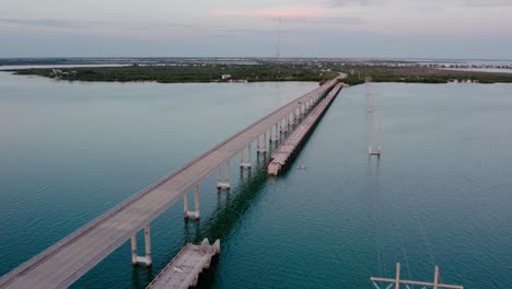 Aerial-sunset-shot-of-the-Summerland-Key-Bridge-in-Florida-which-connects-several-of-the-Florida-Keys-on-the-way-to-Key-West