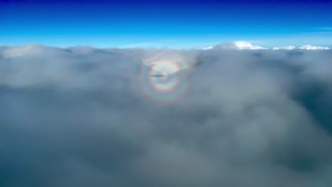 Amazing-view-from-a-jet-cockpit-of-the-halo-and-shadow-of-a-jet-flying-through-layers-of-stratus