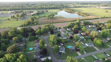 An-aerial-view-of-residential-neighborhood-with-beautiful-lake-in-horizontal-line