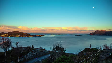 High-angle-shot-over-seaside-view-of-Alesund,-Norway-at-sunset-in-timelapse