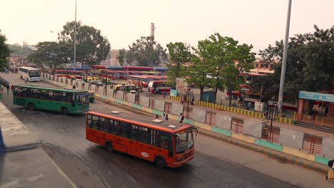 Aerial-View-of-Public-bus-station,-Buses-moving-out-from-the-bus-station-in-the-majestic-bus-station-Bengaluru,-India
