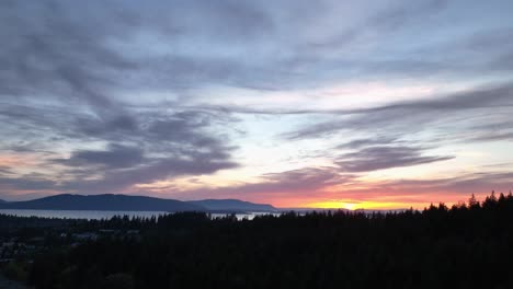 Drone-shot-of-a-beautiful-sunset-over-Bellingham,-WA
