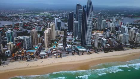 Dolly-aerial-view-of-a-modern-skyscraper-city-by-the-beach