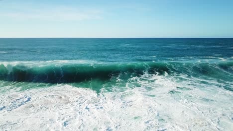 Drone-shot-following-a-powerful-wave-off-the-North-Shore-coastline-of-Oahu,-Hawaii