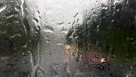 Rain-running-down-the-front-window-of-a-double-decker-bus