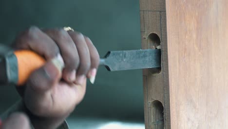 Close-up-of-Carpenter-Chiselling-a-Door