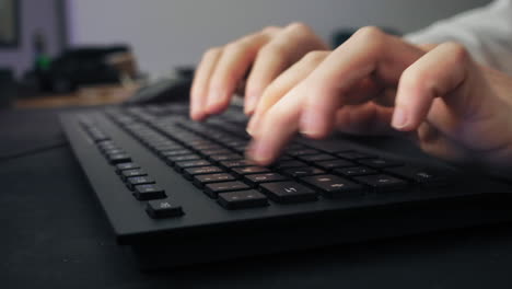Closeup-of-a-male-gamer-writing-on-the-keyboard