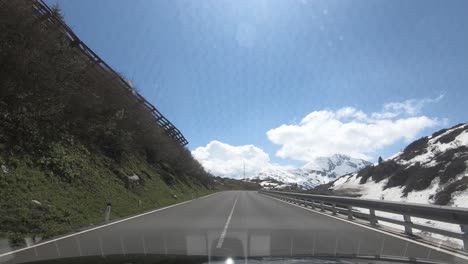 Driving-a-Car-on-winding-rouads-on-the-Arlberg-in-Austria,-Tirol