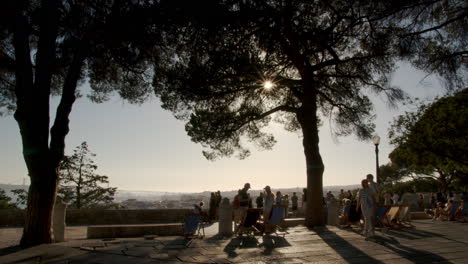 Silhouette-of-Family-on-Viewing-Spot-in-Lisbon-during-Early-Sunset