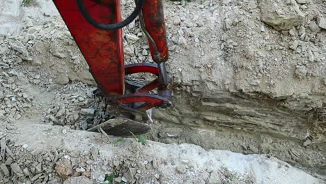 Pit-dug-on-the-ground-by-a-small-crawler-excavator