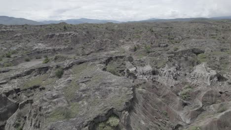 Gray-And-Green-Desert-Ridges-Of-The-Tatacoa-Desert-On-A-Cloudy-Day-In-Huila,-Colombia---drone-shot