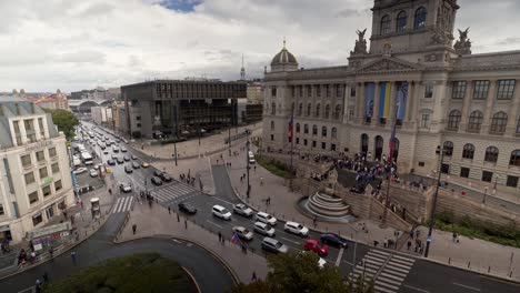 Car-traffic-in-front-of-Czech-national-museum-in-Prague,-wide-panorama