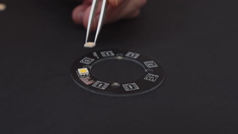 Manually-Placing-SMD-LEDs-with-Silver-Tweezers-on-Black-PCB