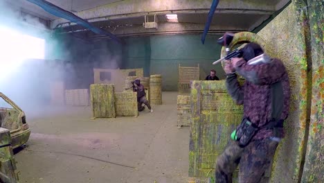Girls-and-boys-playing-paintball-indoor-paintball