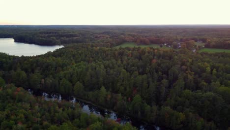 A-panning-drone-shot-of-a-forest-and-lake-in-Woolwich-Maine