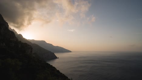 Timelapse-of-the-sun-coming-up-over-the-mountains-of-the-Amalfi-Coastline-in-Italy-in-4k