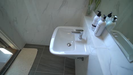 Clean-White-Ceramic-Washbasin-and-Gray-Floor-Tile-Bathroom-Interior-Design,-No-People