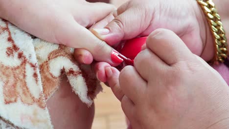Pedicurist-master-making-manicure-cutting-cuticle-with-nail-tongs-on-client's-toes-in-a-beauty-salon-2