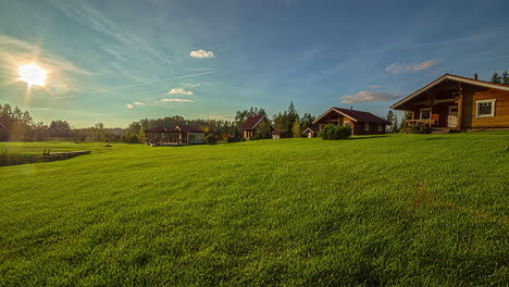 Rural-village-area-with-residential-cottage-house-and-green-grassy-lawn-at-afternoon-with-soothing-sunlight