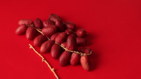 A-bunch-of-ripe-Indian-dates-on-a-red-background
