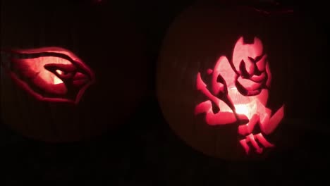Slow-push-in-on-Halloween-pumpkins-carved-with-Arizona-hometown-team-logos