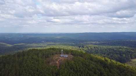 Aerial-footage-flying-over-the-fire-tower-on-Blue-Mountain,-near-Newbury,-central-Victoria,-Australia