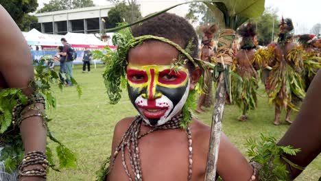 Portrait-of-happy-Papua-New-Guinea-boy-in-face-paint,-slow-motion
