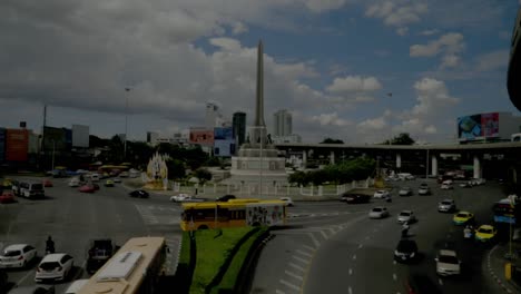 Watching-the-cars-at-the-victory-monument-in-Bangkok