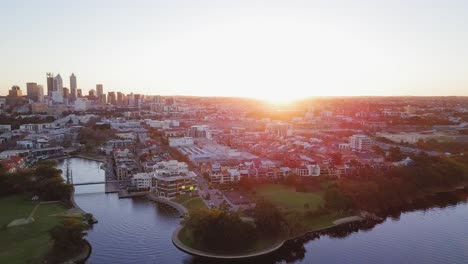 Aerial-view-of-a-Claisebrook-Cove-in-Perth,-Western-Australia-at-sunset-with-skyline-of-the-city-in-the-background
