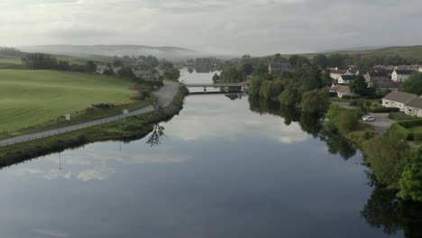 An-aerial-view-of-the-River-Shin-at-Lairg-on-a-calm-and-misty-summer's-moring