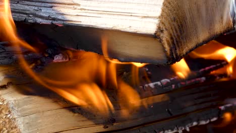 close-up-of-fire-burning-in-a-concrete-pit-in-slow-motion