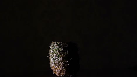 Disassembling-Pineapple,-Ananas-in-The-Dark.-Time-Lapse