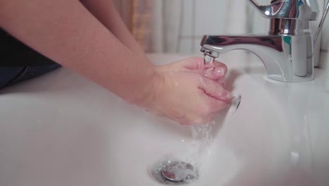 A-female-washing-her-hands-in-slowmotion