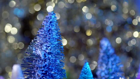Gorgeous-green-sisal-tree-in-focus-with-gold-and-blue-bokeh-glittering-in-the-background