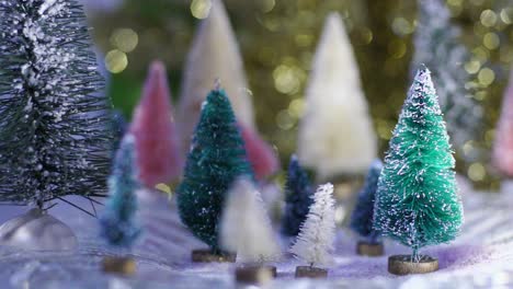 Slow-Motion-snow-glitter-falls-on-bottlebrush-trees-with-blue-and-gold-bokeh-background