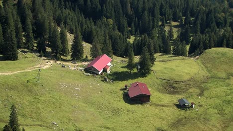 Mountain-pasture-with-huts-in-the-Bavarian-Alps-shot-from-summit-of-Wendelstein-Germany-1
