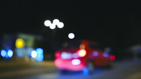 Cars-moving-at-the-bokeh-blurry-street