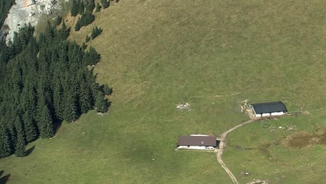 Mountain-pasture-with-huts-in-the-Bavarian-Alps-shot-from-summit-of-Wendelstein-Germany