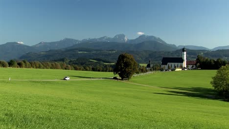 Bavarian-idyll-with-alps-and-church-of-pilgrimage-Wilparting-in-summertime,-Germany