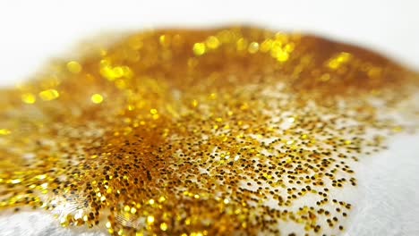 Golden-Wet-Glitter-On-a-White-Paper-With-Uneven-Edge-2