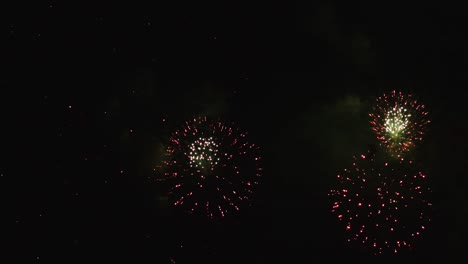 Real-fireworks-exploding-celebration-frame-fill-and-loop-seamlessly-abstract-blur-bokeh-lights-in-the-night-sky-with-the-glowing-fireworks-show-festival
