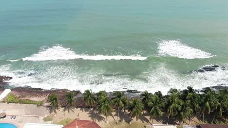 sea-waves-by-house-aerial-view