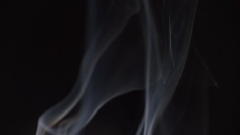 Smoke-swirling-on-dark-background
