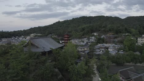 A-drone-shot-of-Senjokaku-five-story-pagoda-on-Miyajima-island,-Japan