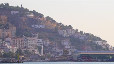 The-hill-houses-and-hotels-of-Kusadasi-Turkey-and-the-hilltop-monument-of-Ataturk