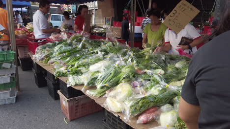 Fresh-green-leafy-vegetables-being-display-for-sell-along-the-side-road