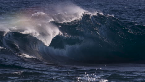 Angry-looking-ocean-before-a-swell-line-turns-into-a-heaving-wave-as-it-breaks-onto-a-rock-shelf-close-to-the-rocky-shore