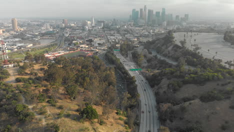 Aerial-of-Downtown-LA-from-Elysian-Park-Over-Highway